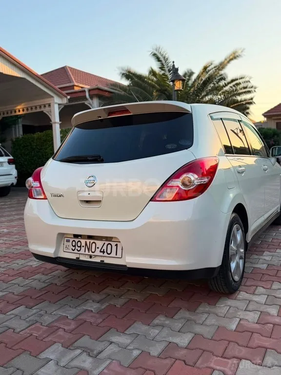 Nissan Tiida — фото 3/4