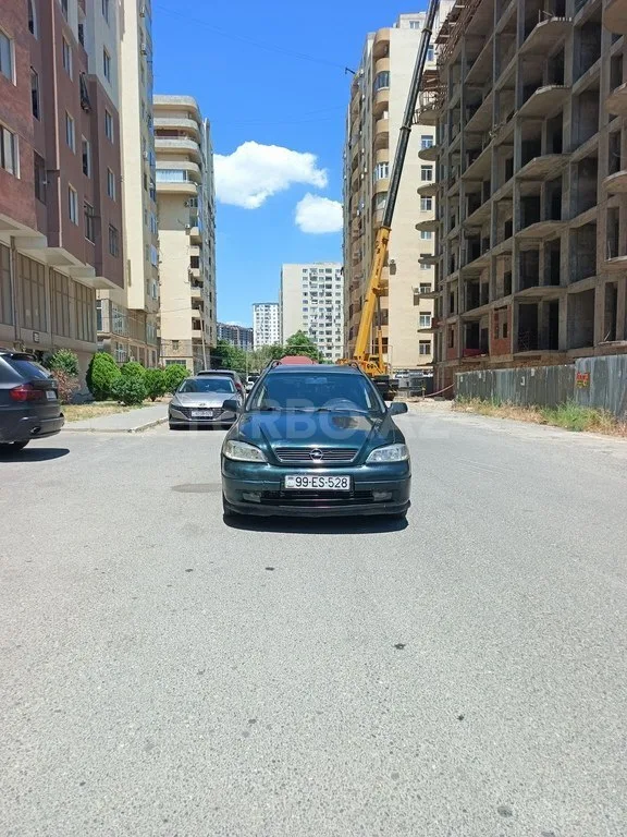Opel Astra — фото 1/4
