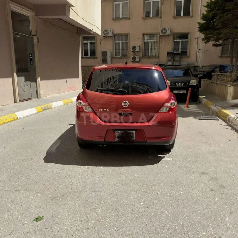 Nissan Tiida — фото 3/4