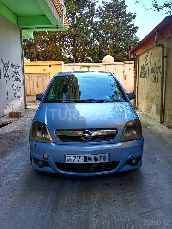 Opel Meriva — фото 1/4