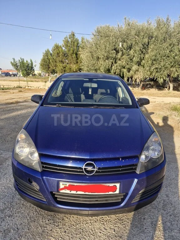 Opel Astra — фото 1/4