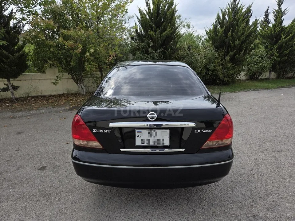Nissan Sunny — фото 3/4