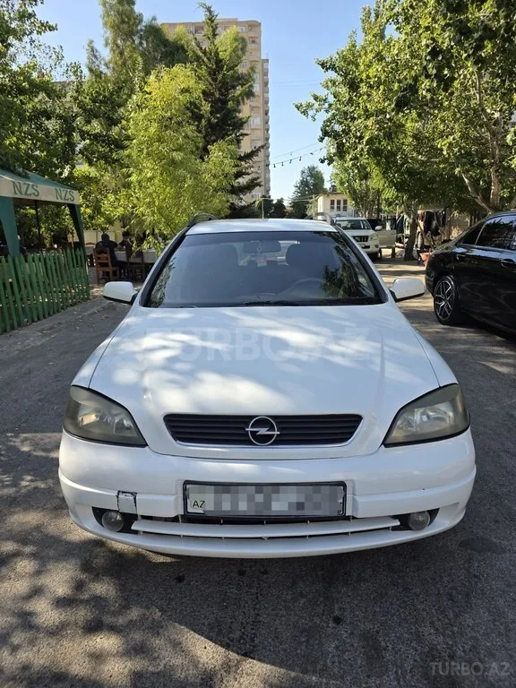 Opel Astra — фото 1/4