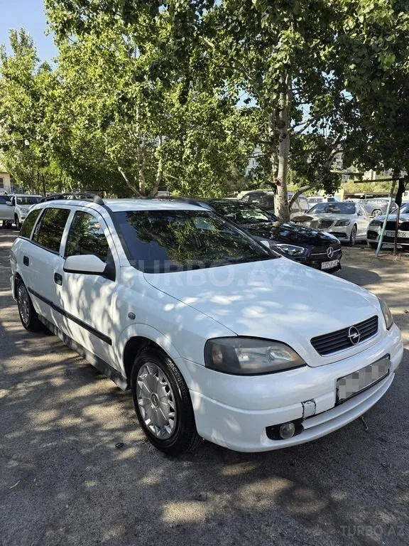 Opel Astra — фото 3/4