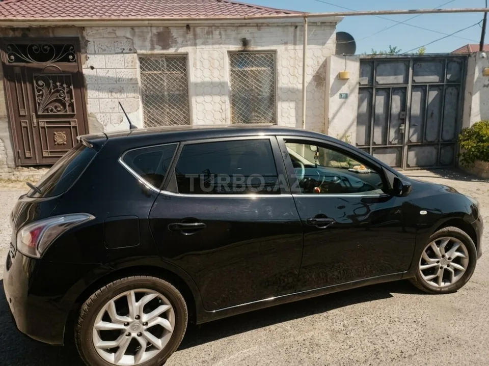 Nissan Tiida — фото 2/4
