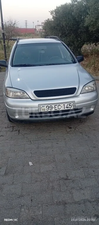 Opel Astra — фото 1/4